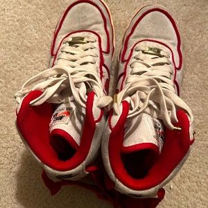 Shoes are worn they are Nike high top air forces red and white